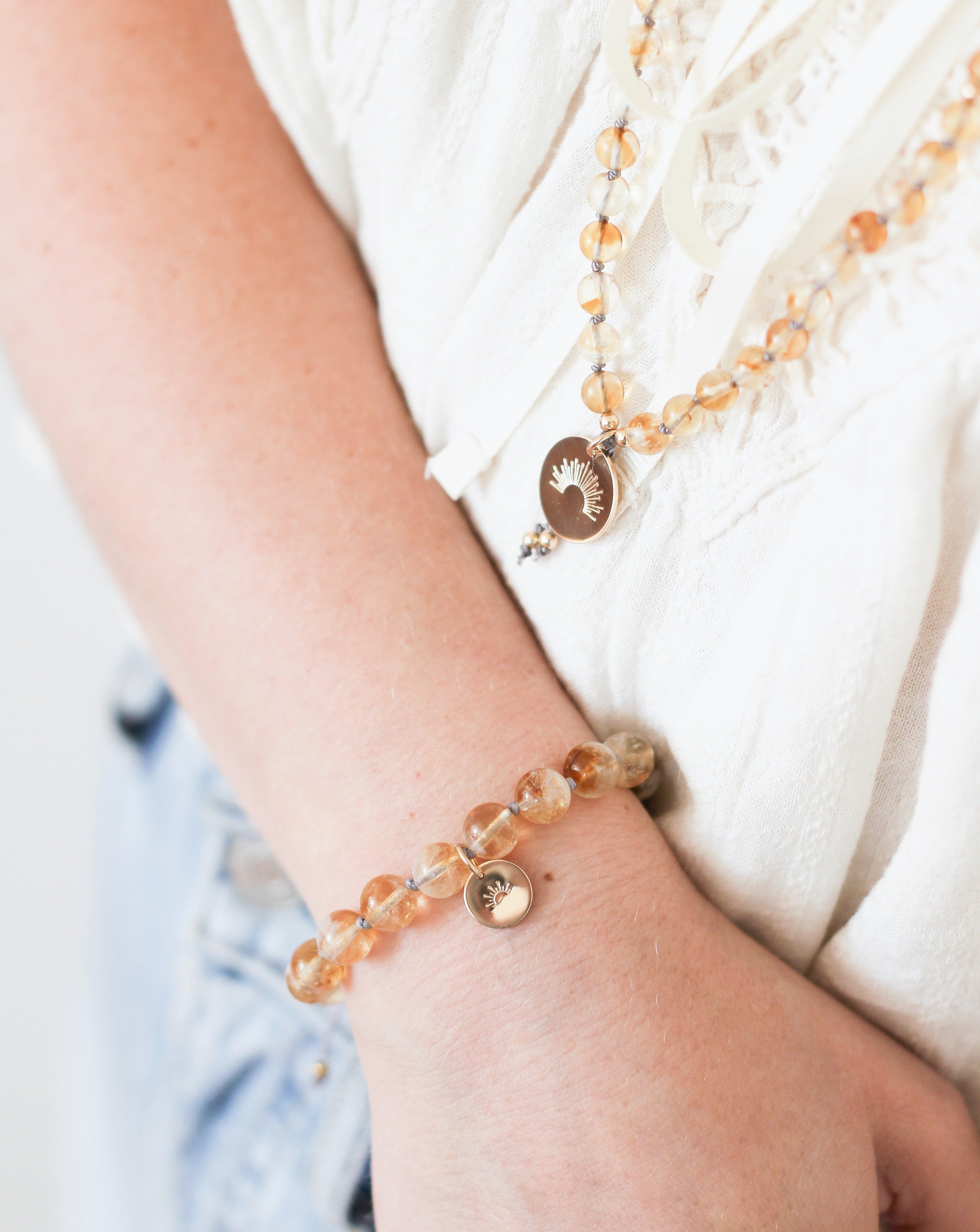 citrine mala bracelet with gold sun charm