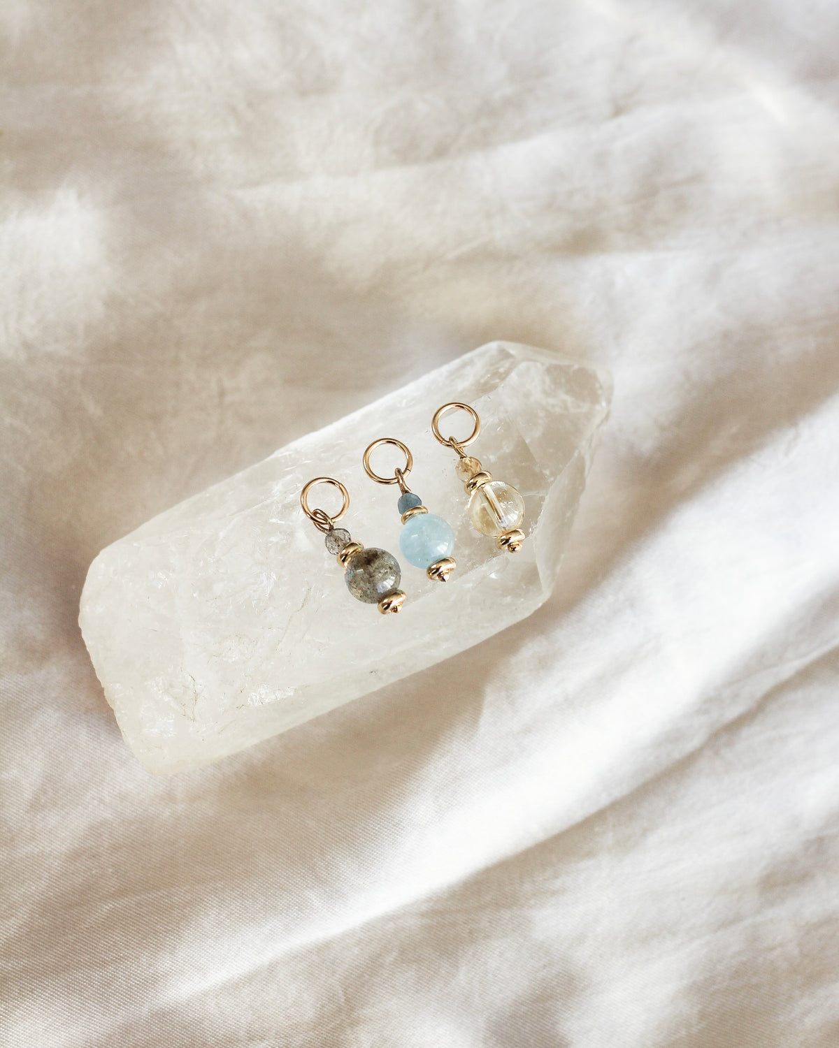 gemstone charms layered with other meaningful charms.