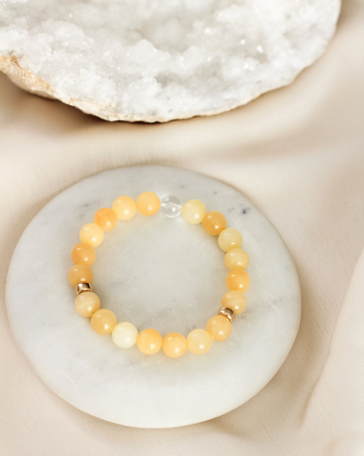 Handmade Honey Calcite beaded bracelet featuring smooth, round 8mm AAA gemstones.