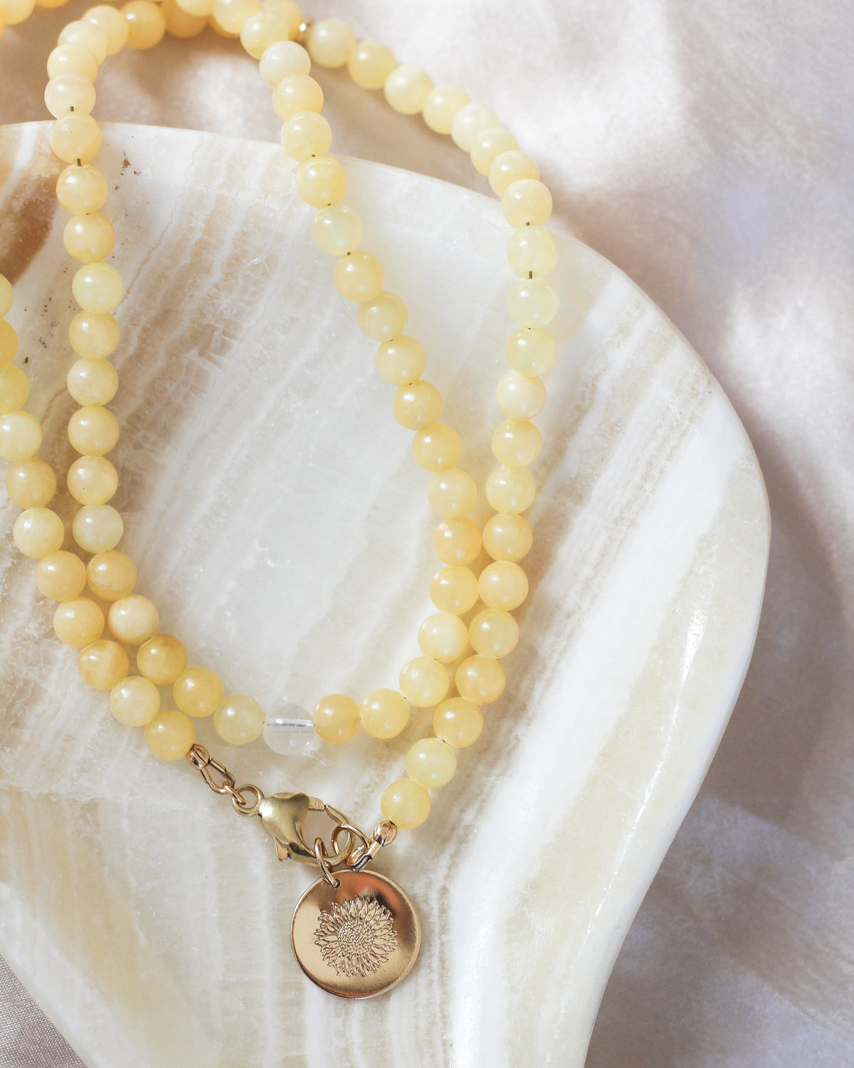 Handmade Honey Calcite beaded necklace featuring smooth, round 6mm AAA gemstones.