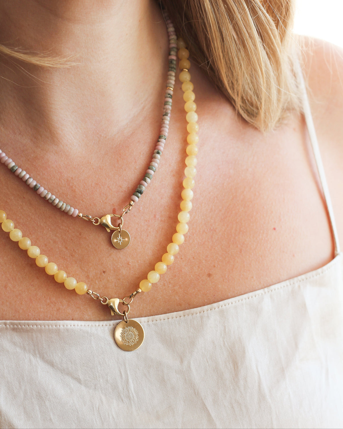 Honey Calcite beaded necklace featuring 6mm round gemstones, worn around the neck.
