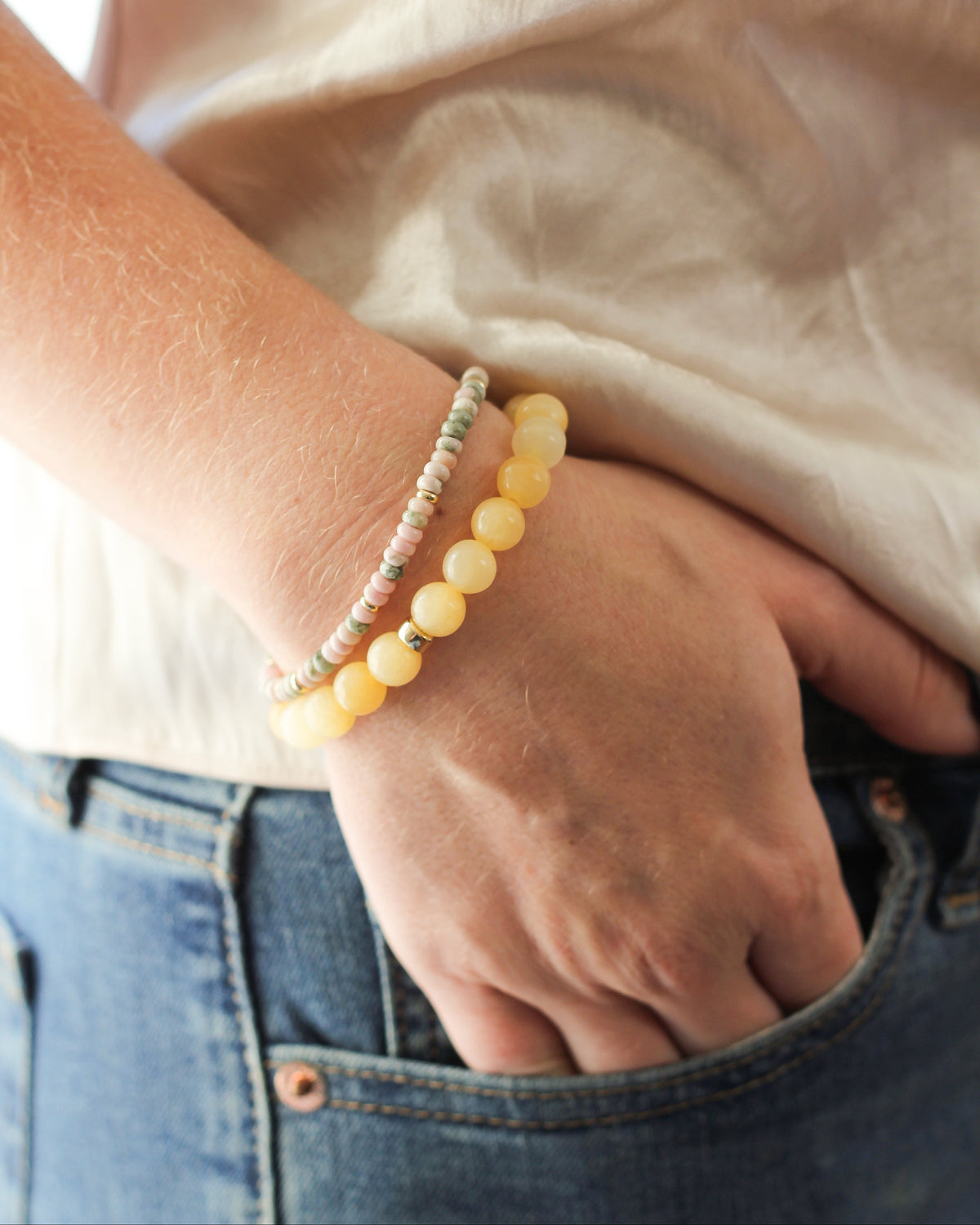 Honey Calcite beaded bracelet stacked with other natural gemstone bracelets.