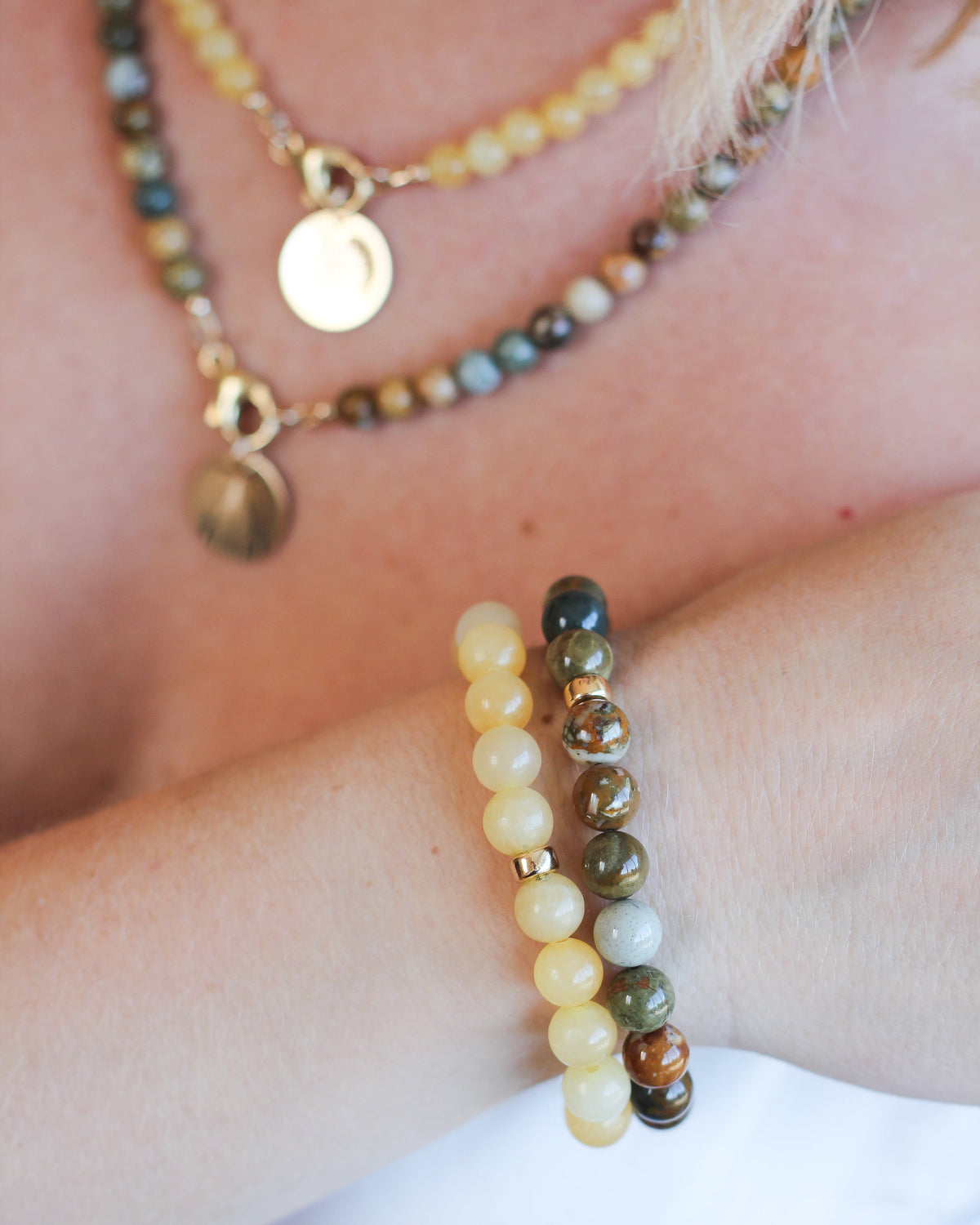 Jasper beaded bracelet stacked with other natural gemstone bracelets.
