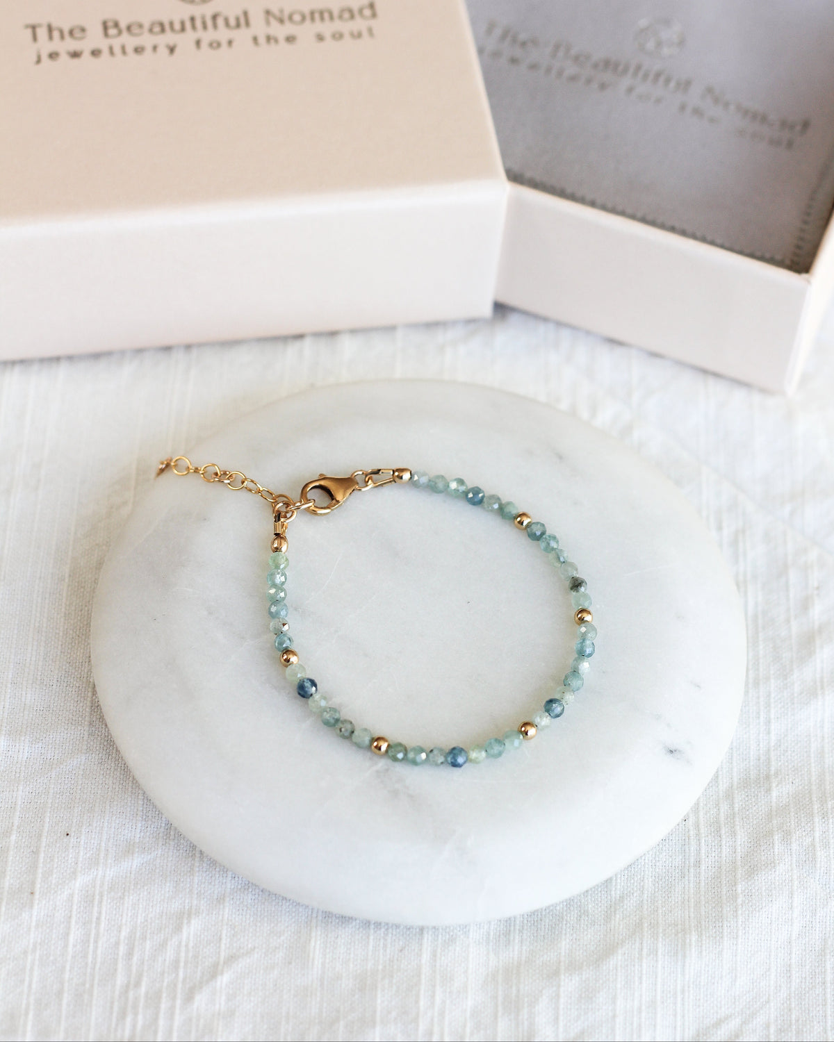 Handmade Kyanite beaded bracelet featuring rare, bicolour 3mm faceted gemstones.