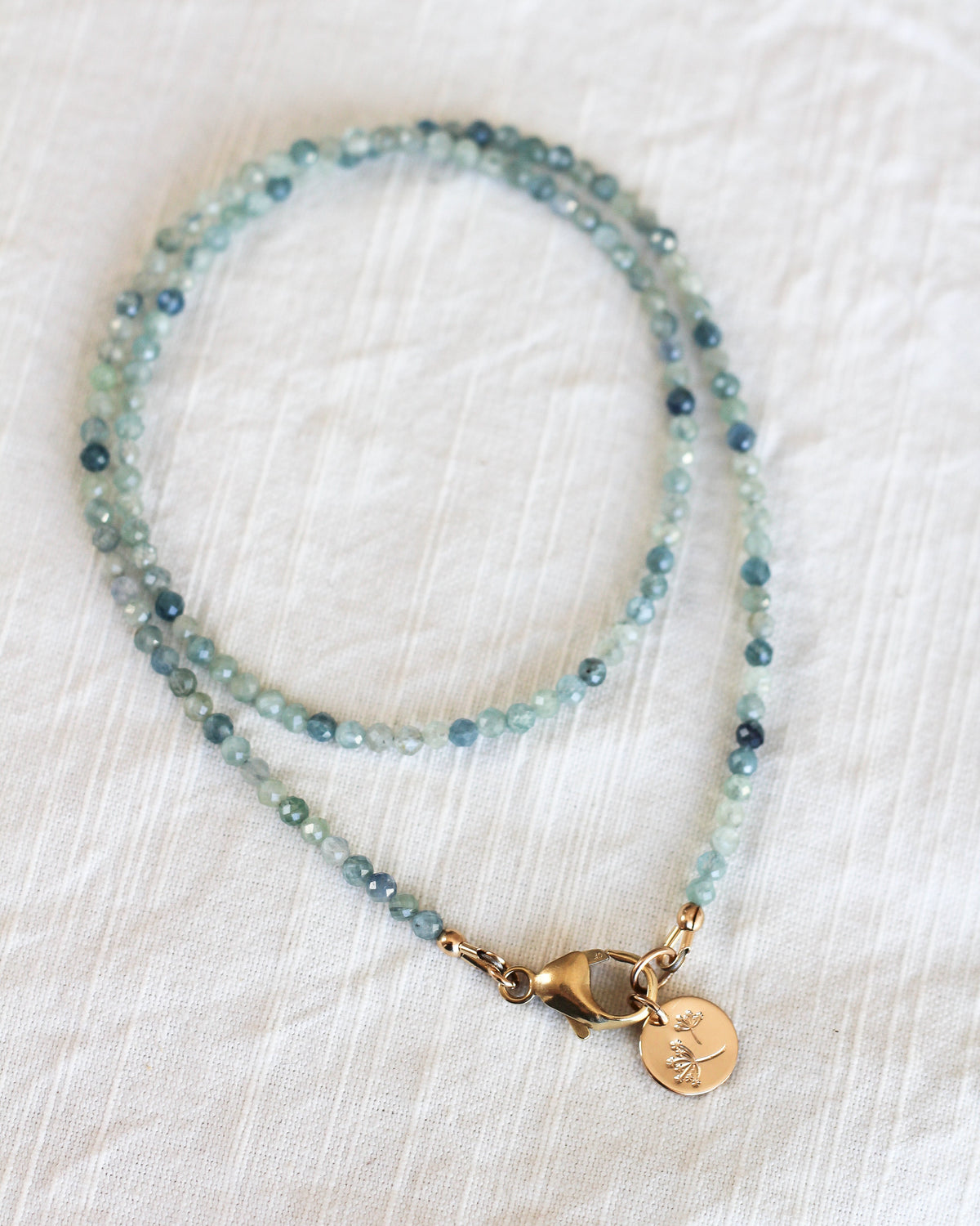 Handmade Kyanite beaded necklace featuring rare, bicolour 3mm faceted gemstones.