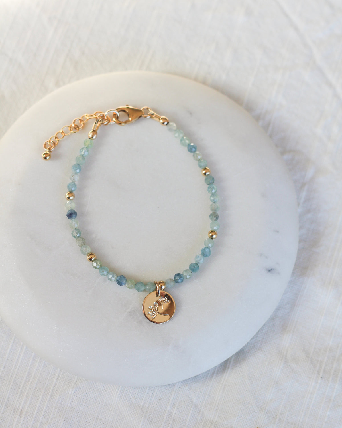 Handmade Kyanite gemstone bracelet personalized with meaningful charms.