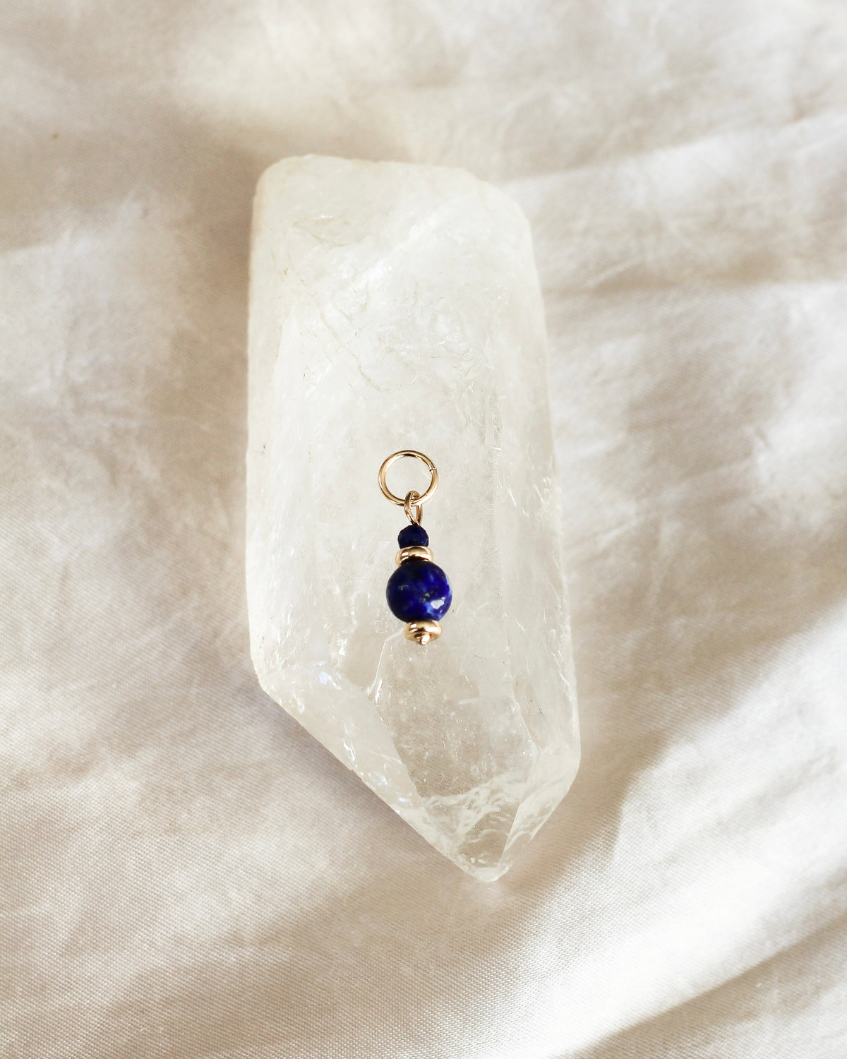 Handmade Lapis Lazuli gemstone charm featuring rich blue natural gemstone beads.