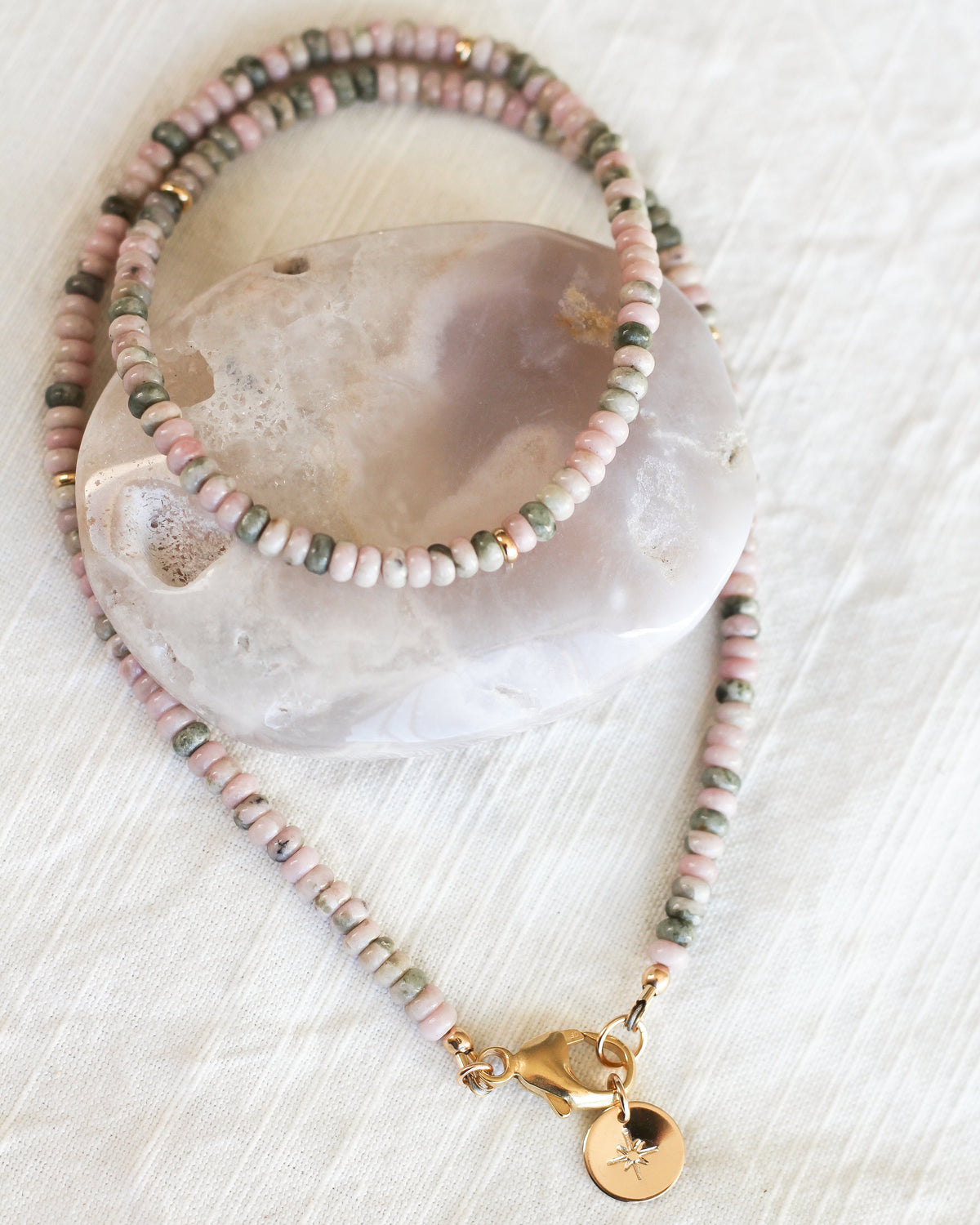 Handmade Nevada Lapis beaded necklace featuring natural pink and green 4mm rondelle gemstones.