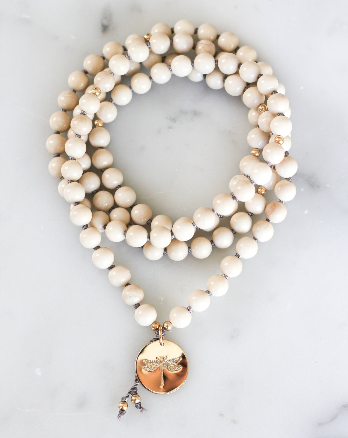 riverstone mala pendant necklace with dragonfly medallion