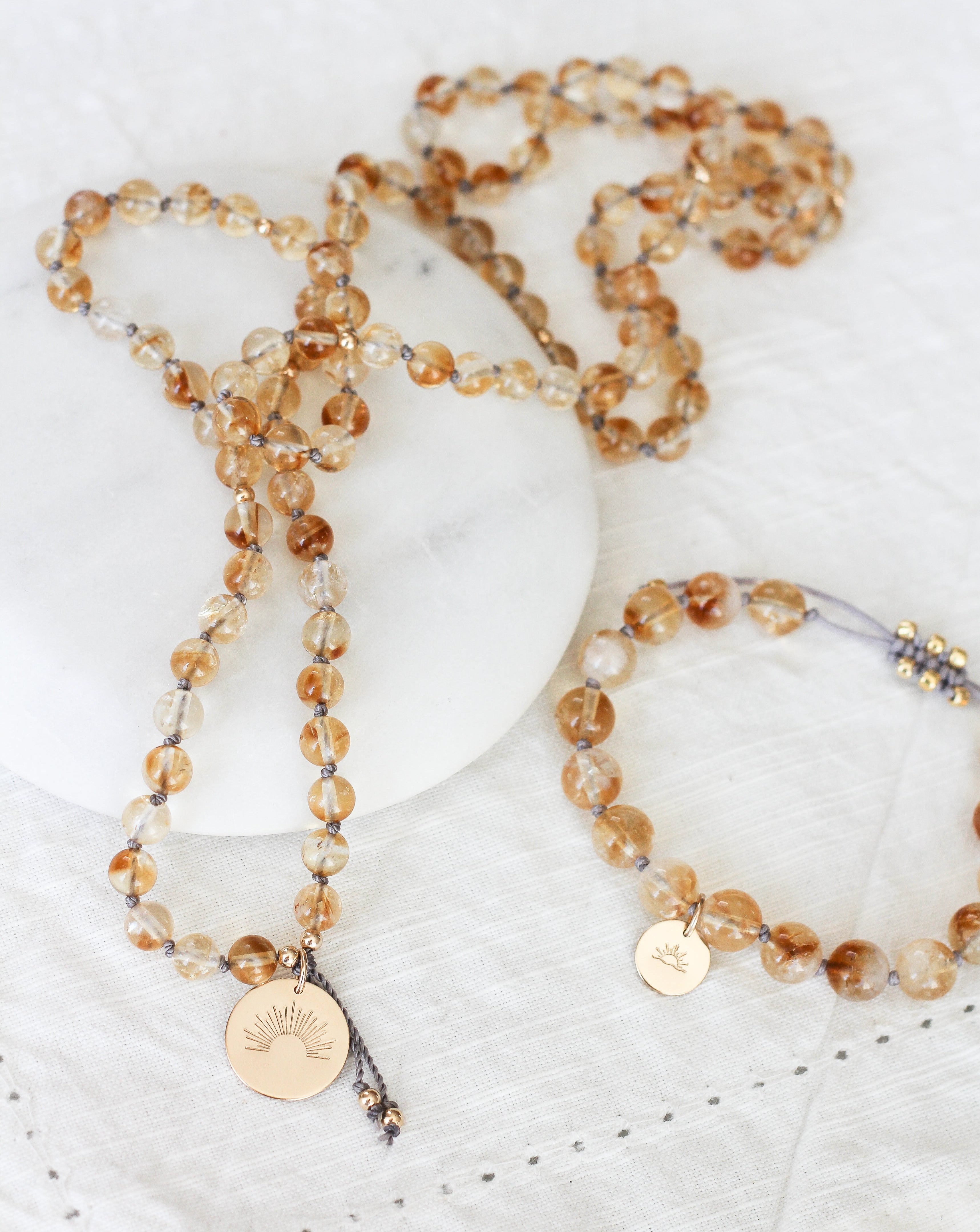 citrine mala pendant necklace with gold sun pendant