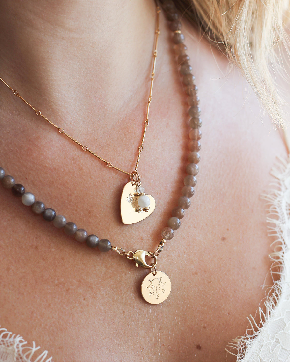 Coffee Moonstone beaded necklace layered with delicate gold chain necklaces.