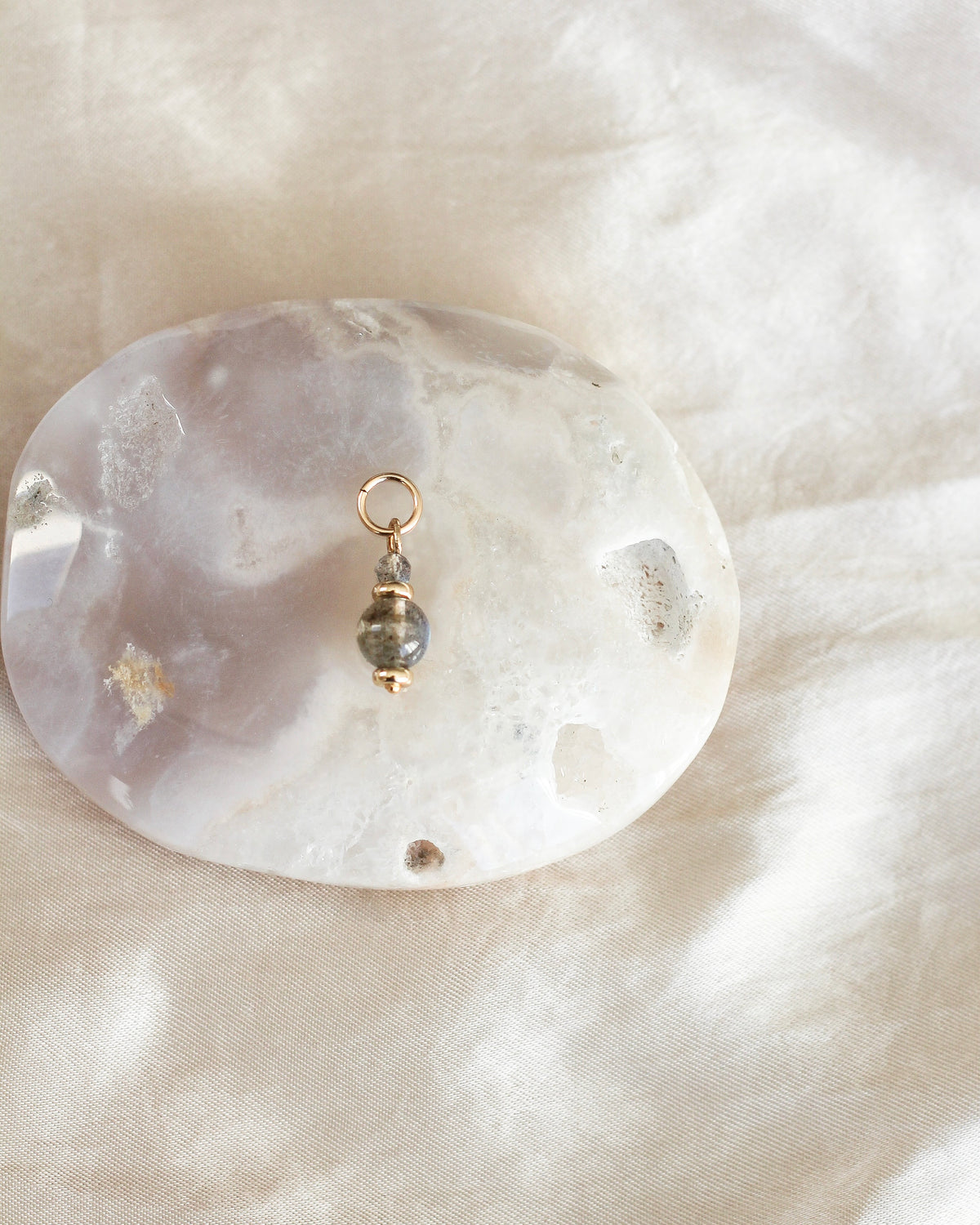 Handmade Labradorite gemstone charm featuring natural green Emerald beads.
