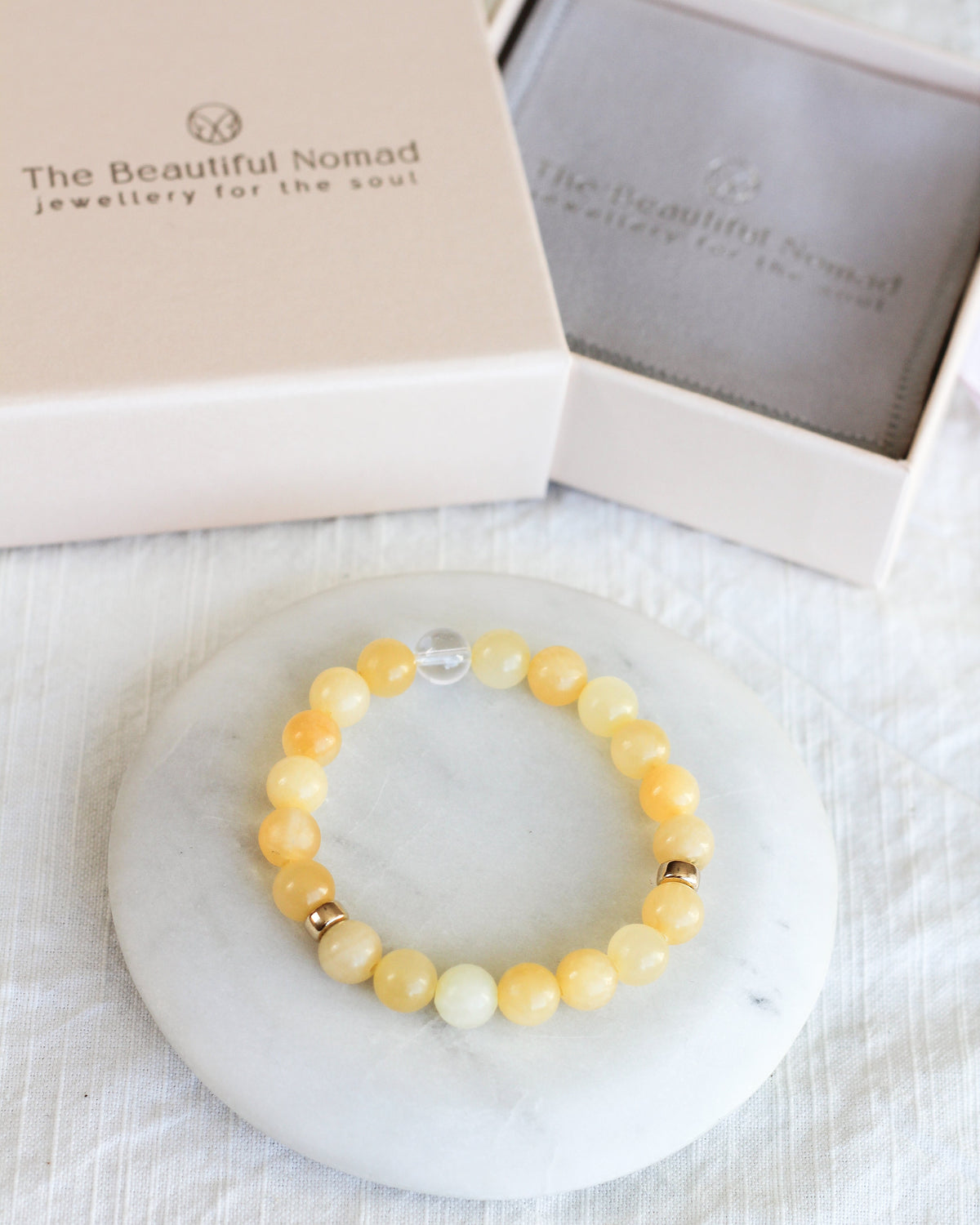Handmade Honey Calcite beaded bracelet featuring smooth, round 8mm AAA gemstones.