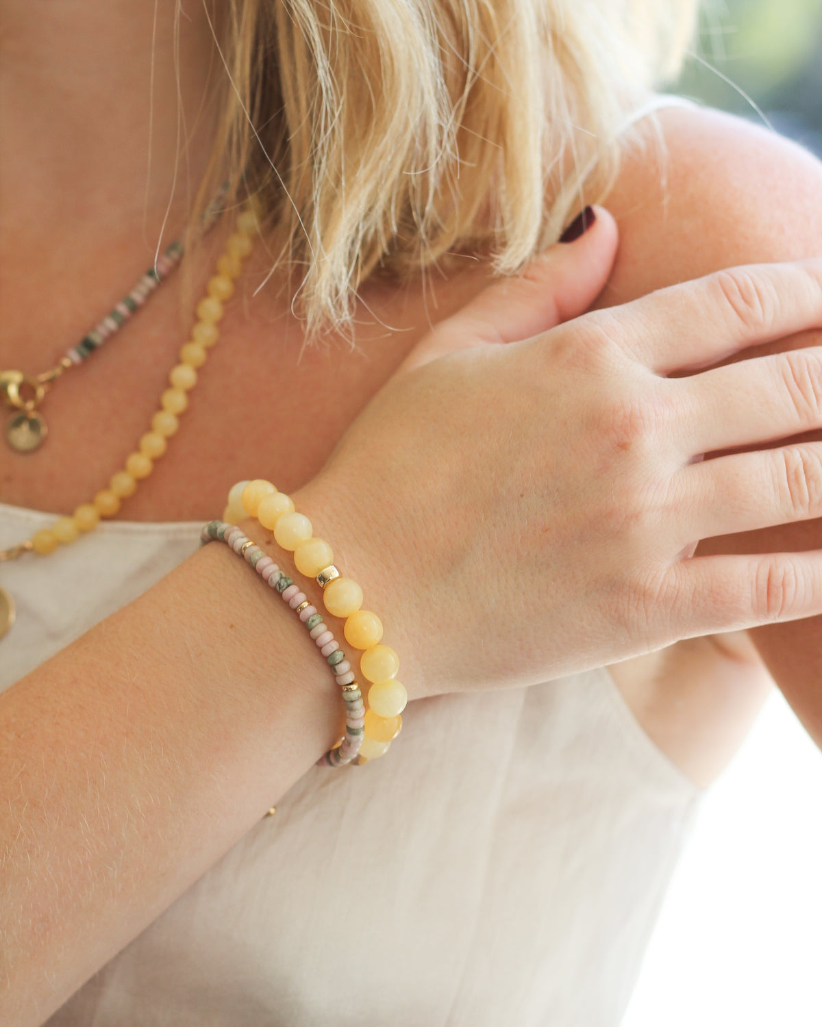 Honey Calcite stretch beaded bracelet featuring 8mm round gemstones, worn on the wrist.