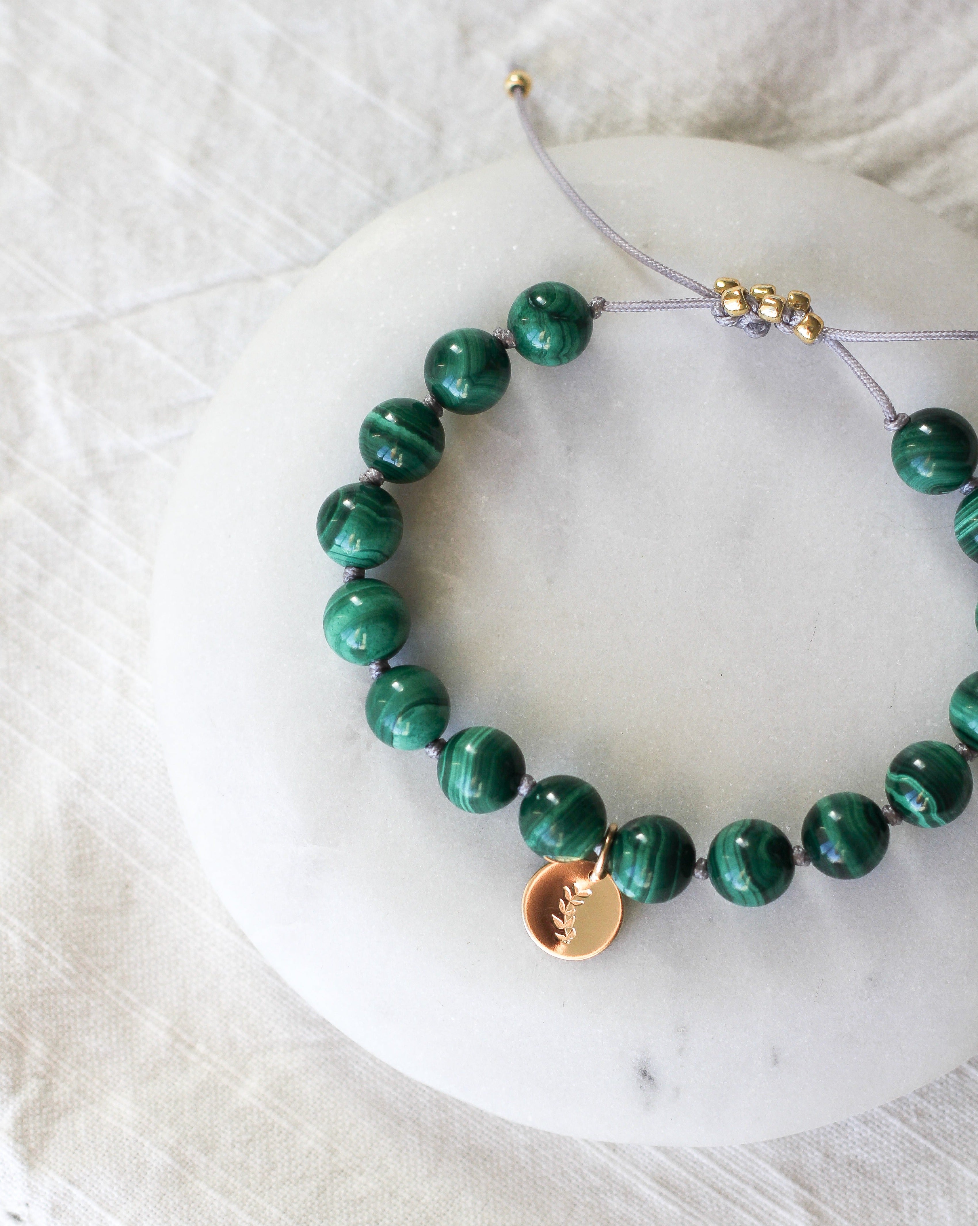 malachite mala bracelet with gold charm