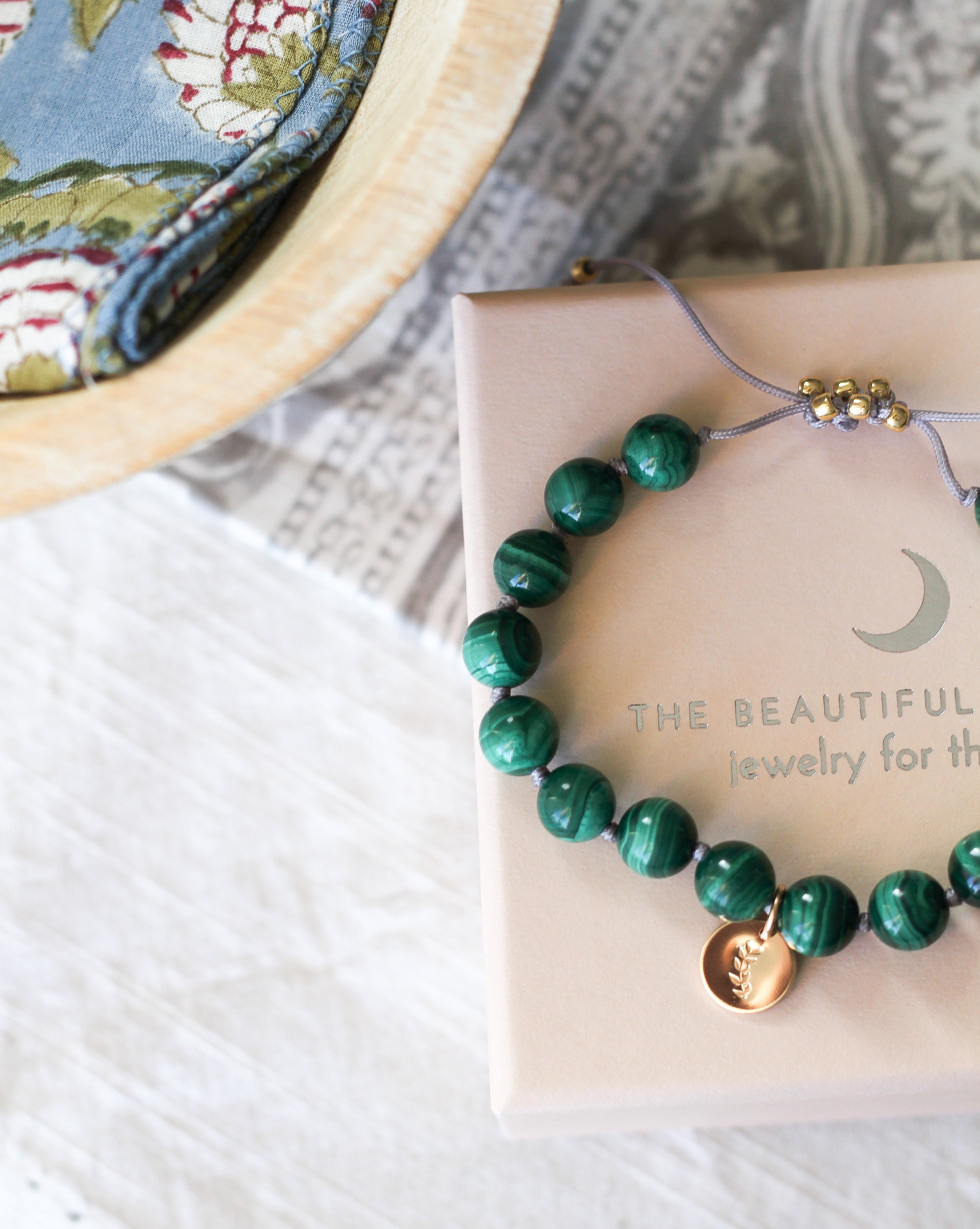 malachite mala bracelet with gold charm