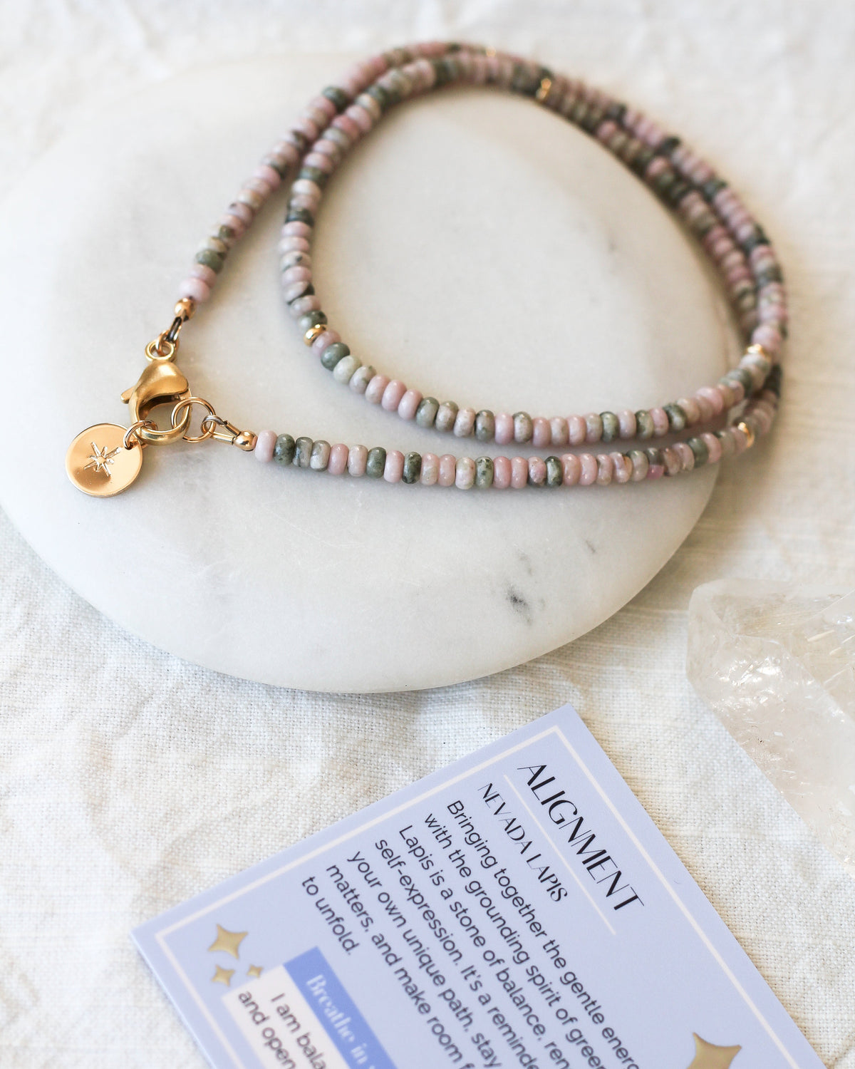 Handmade Nevada Lapis beaded necklace featuring natural pink and green 4mm rondelle gemstones with meaning card
