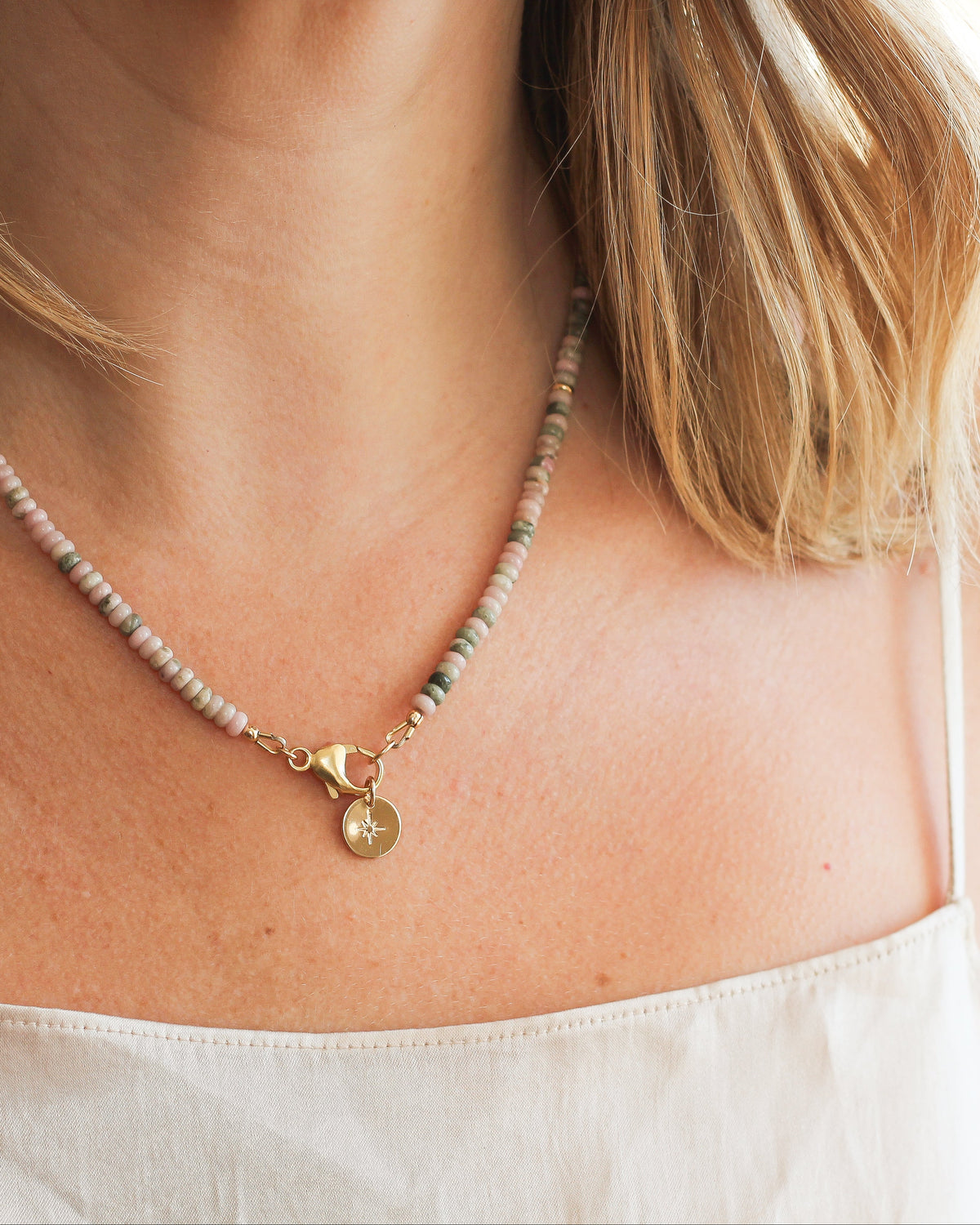 Delicate Nevada Lapis beaded necklace worn around the neck.