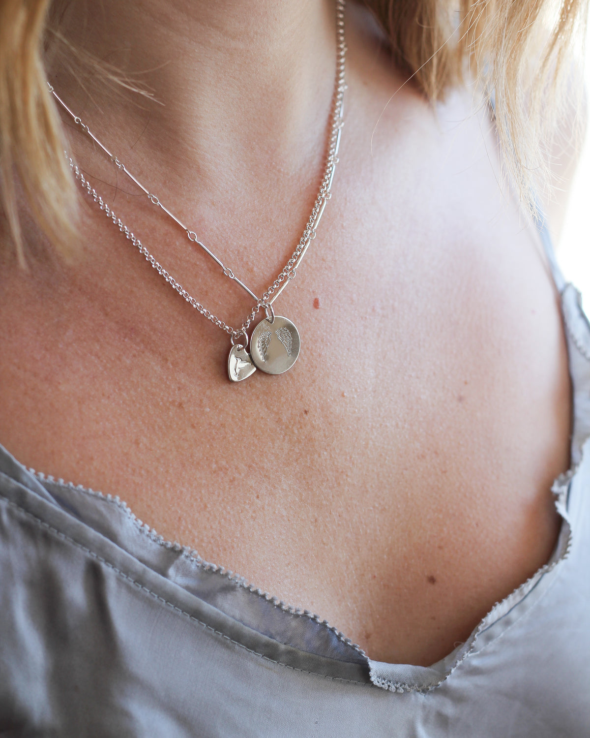 sterling silver rolo chain layered with charms