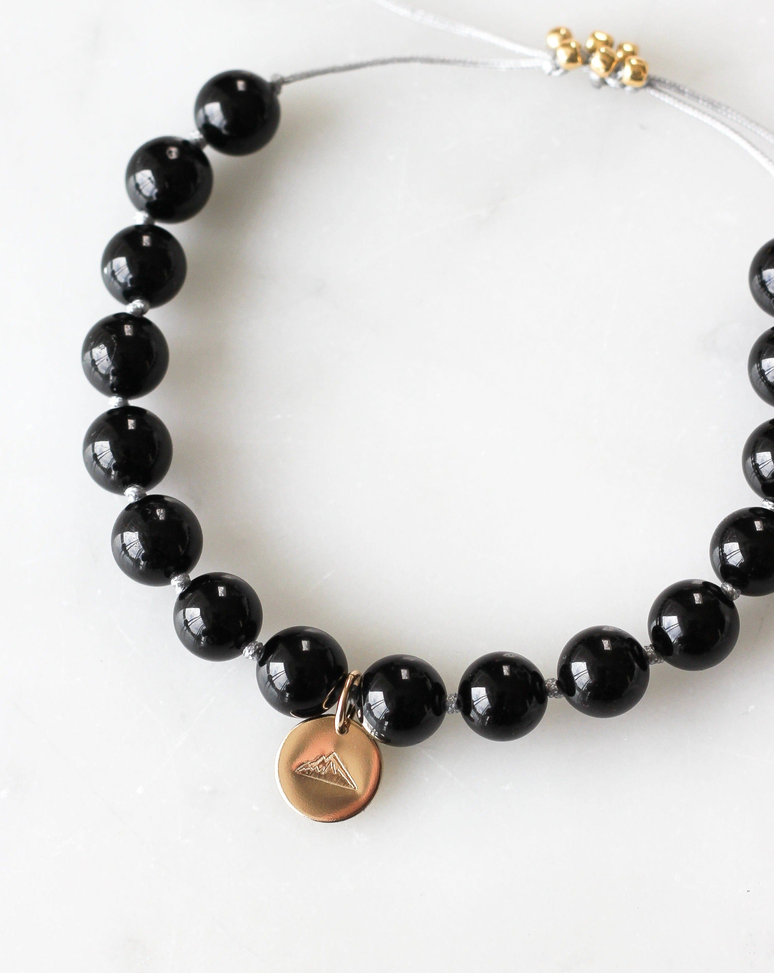 black tourmaline mala bracelet with mountain charm